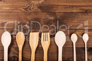 wood  spoon on wood  background dark brown.