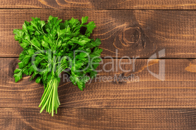 Fresh parsley on wood background