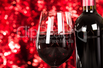 Close up on Glass of Red Wine with Lights Background.