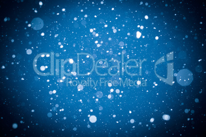 Winter background. falling snow on blue background