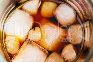 Cola in glass with ice from top