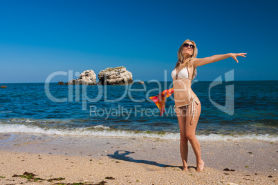 Attractive and sexy blonde girl on the beach