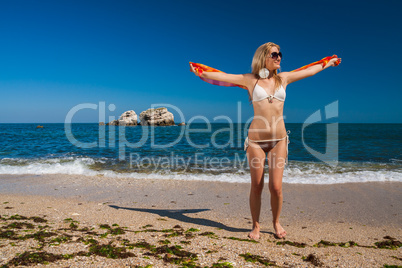 Attractive and sexy blonde girl on the beach