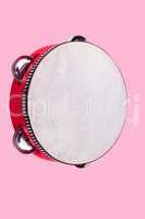 tambourine isolated on pink