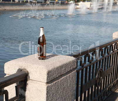 bottle on fence