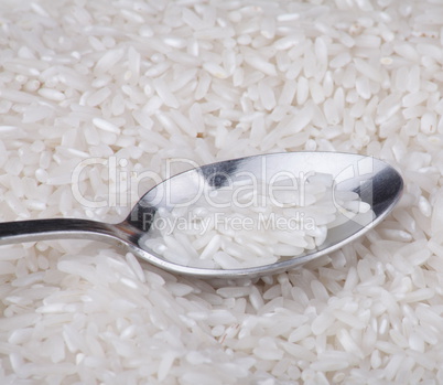 rice food background and teaspoon