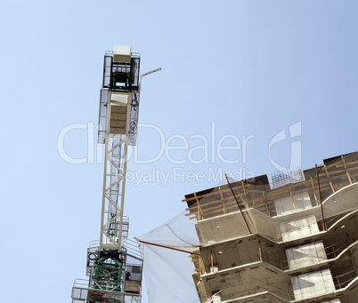 house develop with crane at day