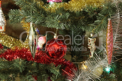 many of toys on green christmas fir