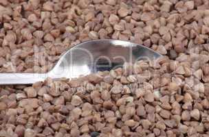 buckwheat background and teaspoon