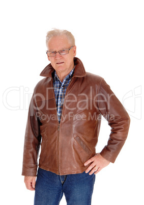 Mature man in leather jacket standing.