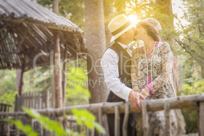 1920s Dressed Romantic Couple Kissing on Wooden Bridge