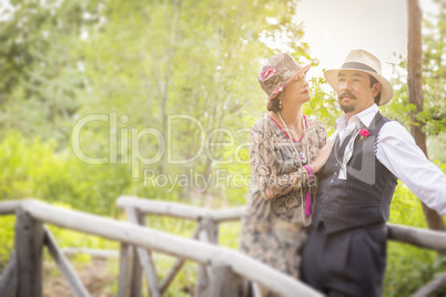 1920s Dressed Romantic Couple on Wooden Bridge