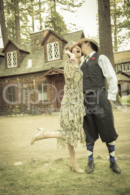 1920s Dressed Romantic Couple in Front of Old Cabin