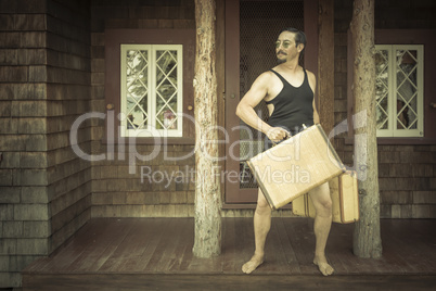 Gentleman Dressed in 1920?s Era Swimsuit Holding Suitcases on