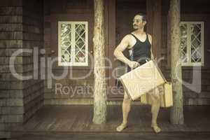 Gentleman Dressed in 1920?s Era Swimsuit Holding Suitcases on