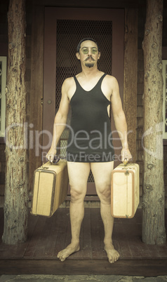 Gentleman Dressed in 1920?s Era Swimsuit Holding Suitcases on