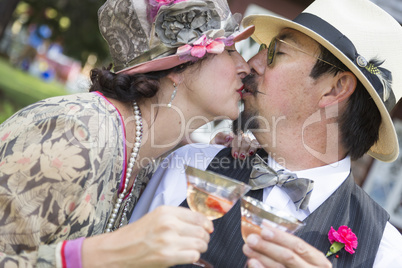 Mixed-Race Couple Dressed in 1920?s Era Fashion Sipping Champa
