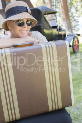 1920s Dressed Girl With Suitcase Near Vintage Car