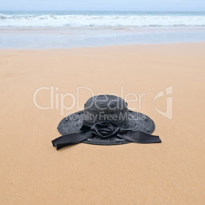 sun hat on the sandy beach