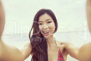 Asian Woman Girl at Beach Taking Selfie Photograph