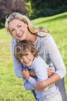 Mother Son Woman Boy Child Laughing Outside in Sunshine