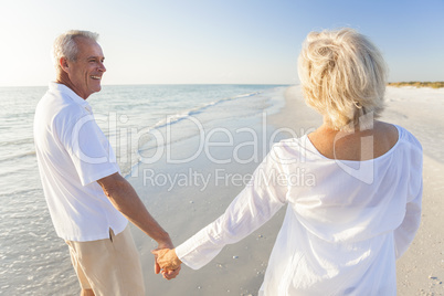 Happy Senior Couple Walking Holding Hands Tropical Beach