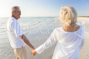 Happy Senior Couple Walking Holding Hands Tropical Beach