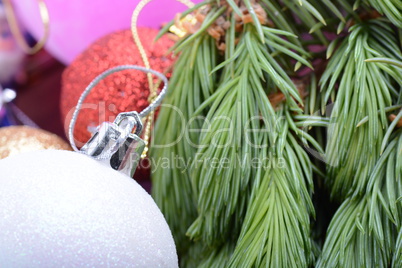 Closeup of beautiful Christmas baubles, Decorated christmas tree, holiday background, green tree eve branch close up with christmas balls