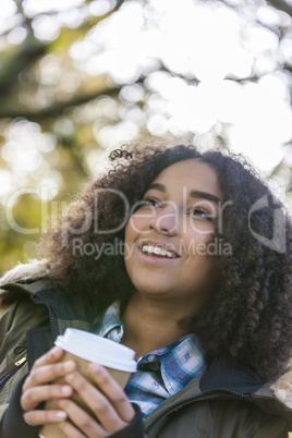 Mixed Race African American Girl Drinking Coffee Outside