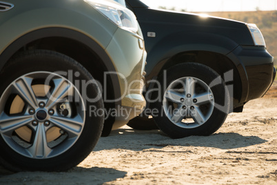 Two SUVs Parked on the Sand