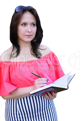 Brunette wrote in the diary isolated on a white background