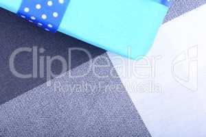 blue gift box with white ribbon