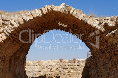 Ancient stone arch and wall of Kerak Castle in Jordan