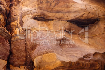 Red striped rock texture in Wadi Mujib canyon in Jordan