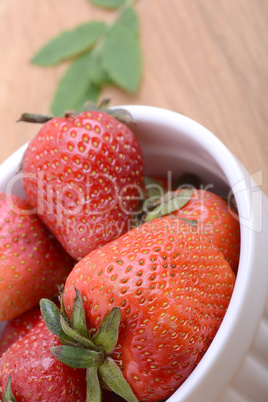 Close up strawberry on wooden plate