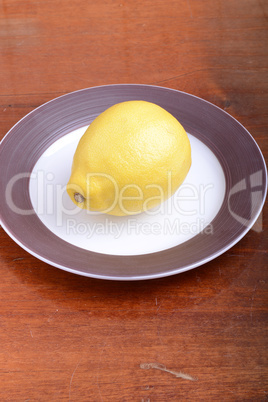 fresh lemon on grey plate