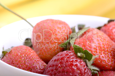 healthy strawberry smoothie with fruits on wooden background