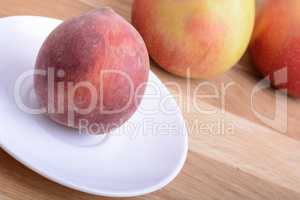 fruits on wodden table, peach, apple, food concept