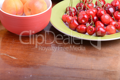 Fresh berries background: apricots, cherries, raspberry, strawberry