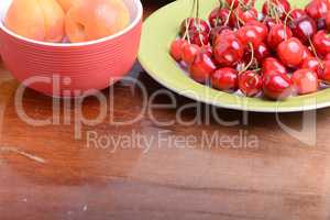 Fresh berries background: apricots, cherries, raspberry, strawberry