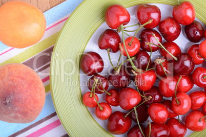 mandarin, peach and cherry fresh fruits and berries, summer health food, top view