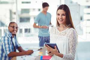 Young creative worker smiling at camera