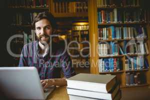 Hipster student studying in library