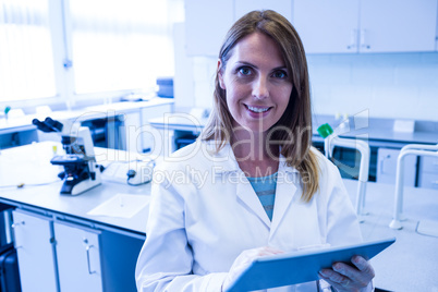 Scientist working in the laboratory with tablet