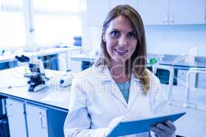 Scientist working in the laboratory with tablet