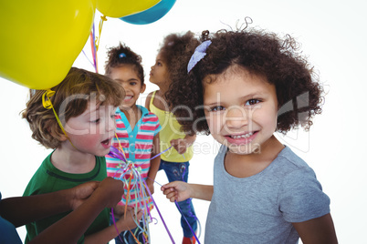 Group of kids together with balloons