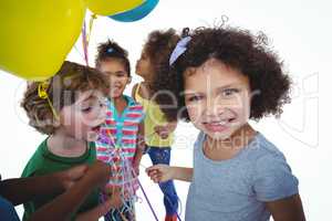 Group of kids together with balloons