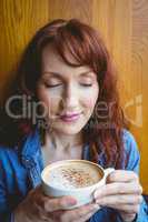 Mature student having coffee in cafe