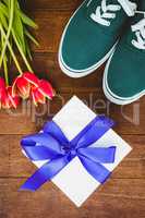 View of sneakers and blue gift