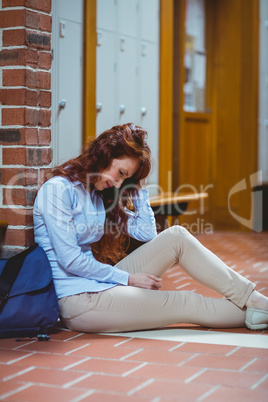 Mature student feeling stressed in hallway